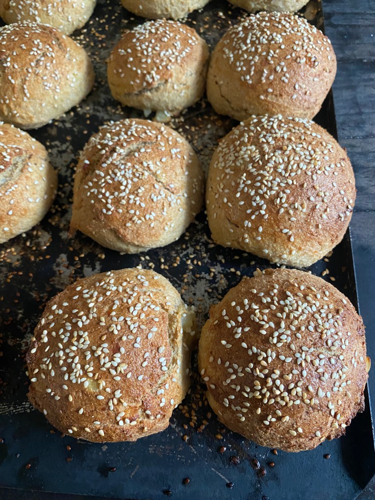 burger buns with sesame seeds on top
