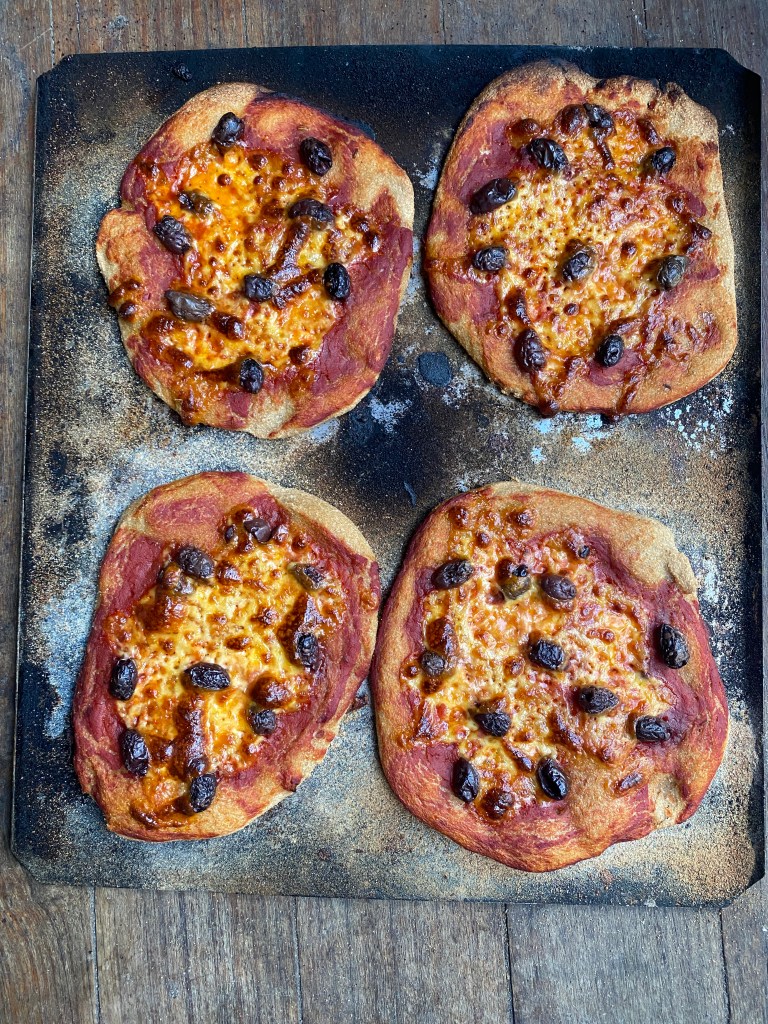 sourdough pizza with olives and mozzarella